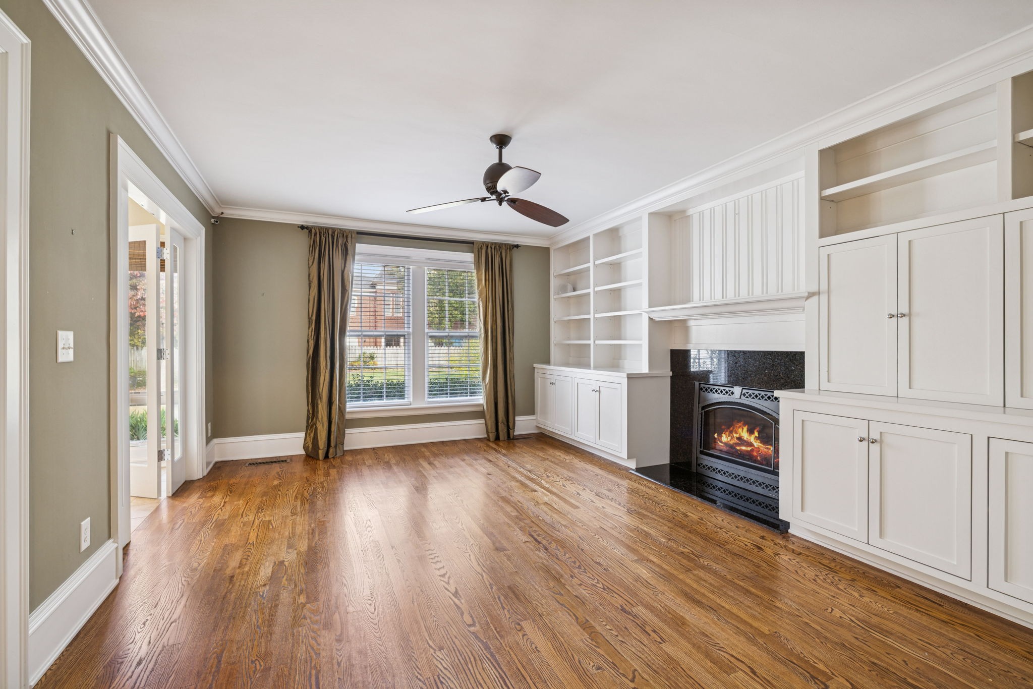 215 4th Avenue South Franklin, TN 37064 - Photo 67 of 86 a view of empty room with wooden floor and fireplace