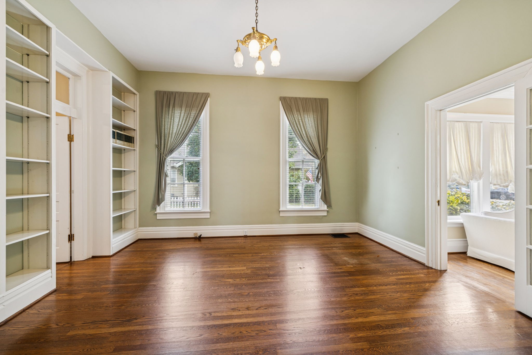 215 4th Avenue South Franklin, TN 37064 - Photo 76 of 86 an empty room with wooden floor and windows
