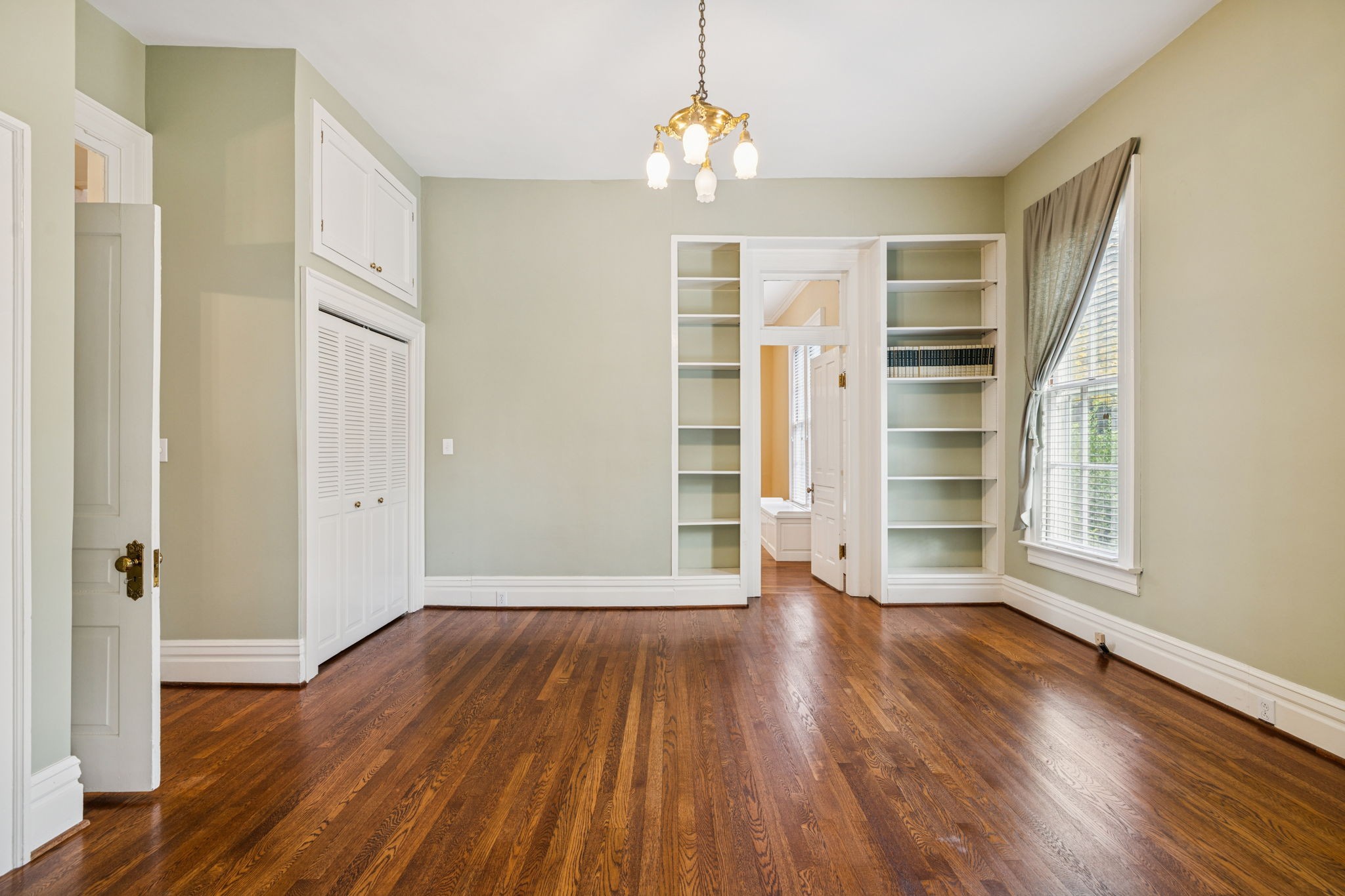 215 4th Avenue South Franklin, TN 37064 - Photo 77 of 86 an empty room with wooden floor closet and windows