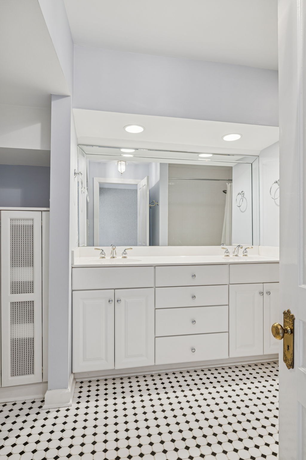 215 4th Avenue South Franklin, TN 37064 - Photo 86 of 86 a bathroom with a sink a vanity and mirror