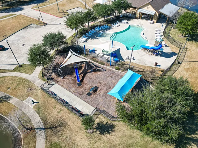 an aerial view of a house with a swimming pool
