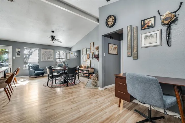 a view of a dining room with furniture and wooden floor
