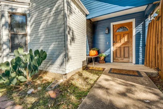 a front view of a house with outdoor seating
