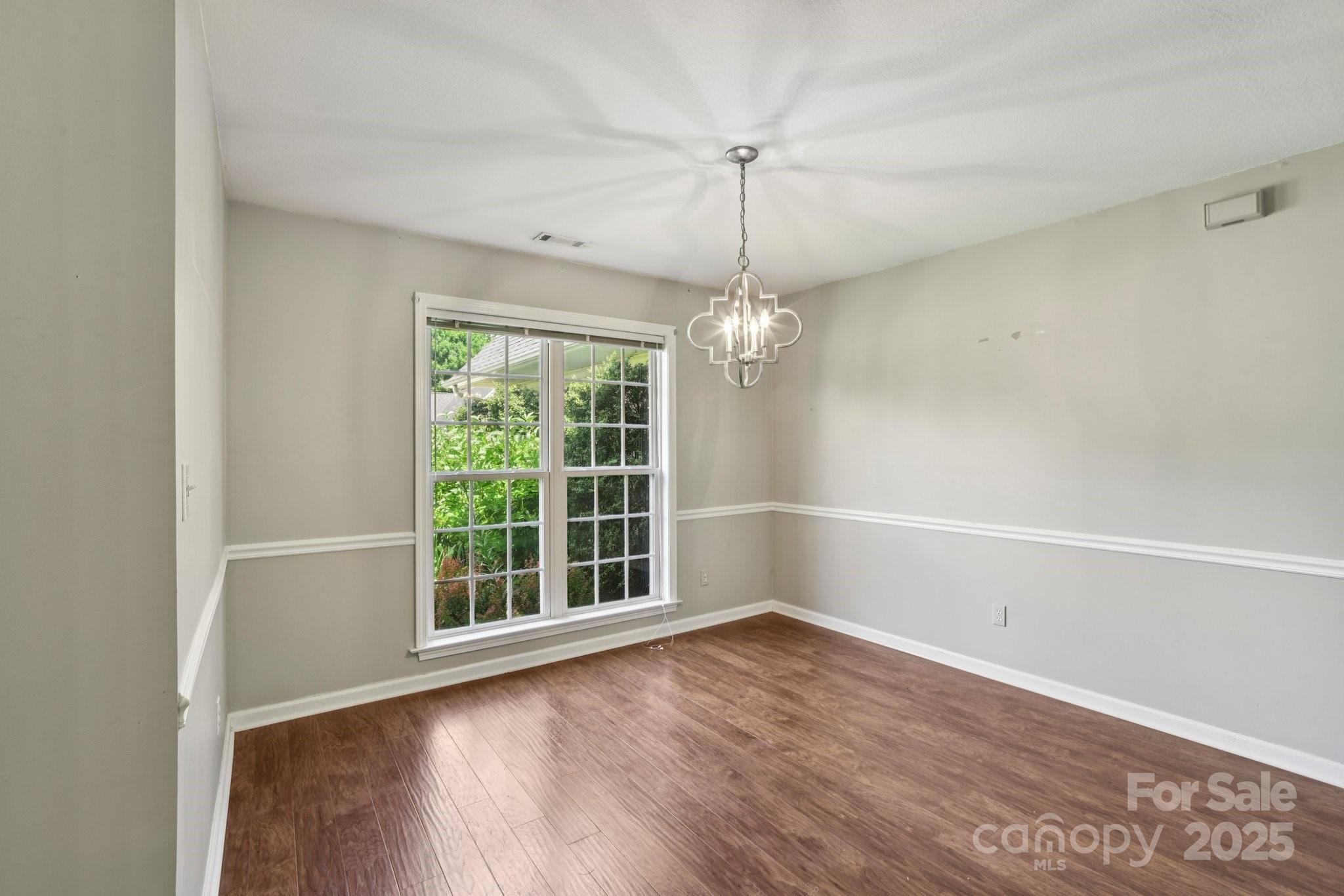 343 Stonehollow Road Fletcher, NC 28732 - Photo 12 of 36 wooden floor in an empty room with a window