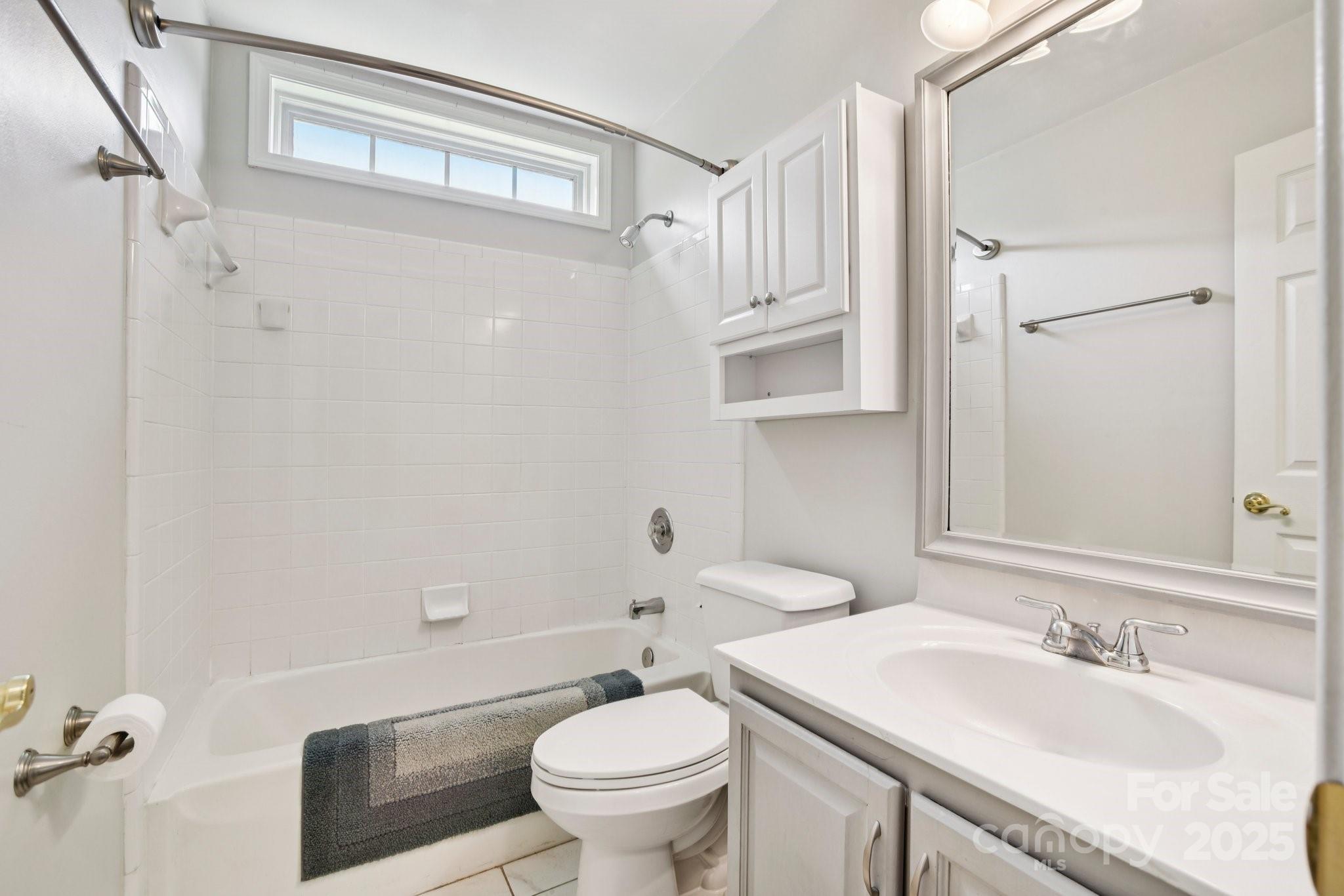 343 Stonehollow Road Fletcher, NC 28732 - Photo 24 of 36 a bathroom with a sink a toilet and a mirror