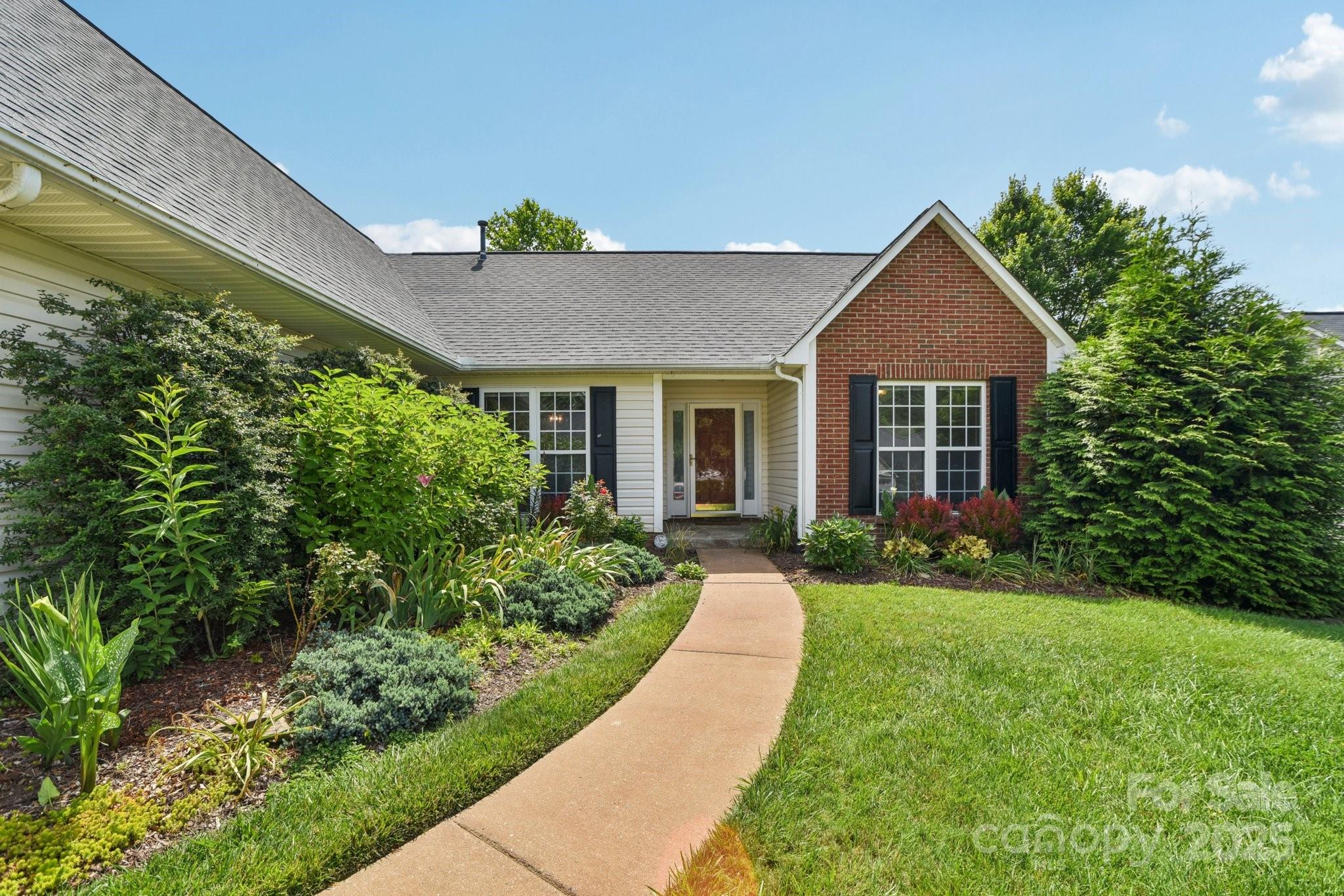 343 Stonehollow Road Fletcher, NC 28732 - Photo 3 of 36 a front view of a house with a yard