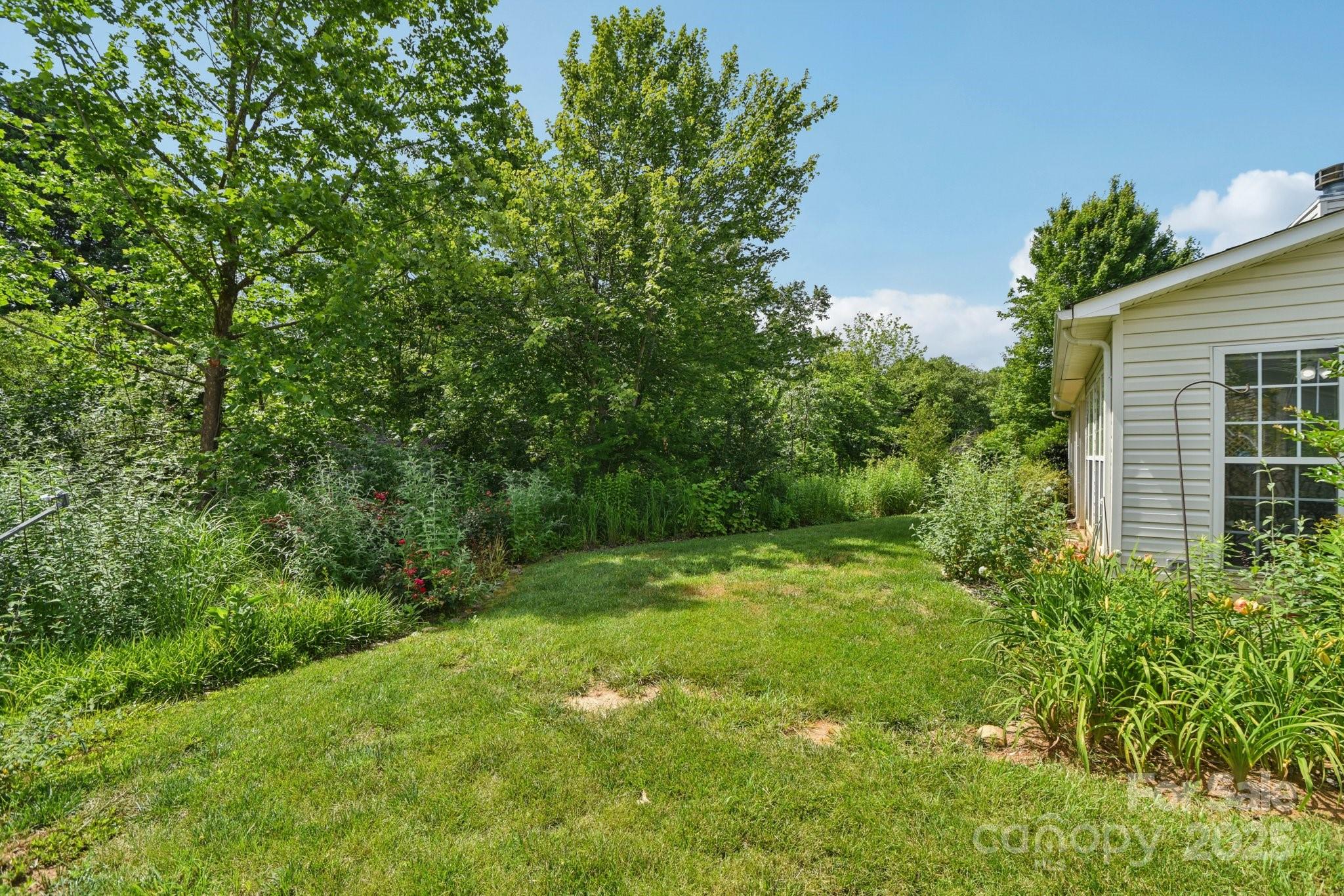 343 Stonehollow Road Fletcher, NC 28732 - Photo 31 of 36 a view of a lush green space