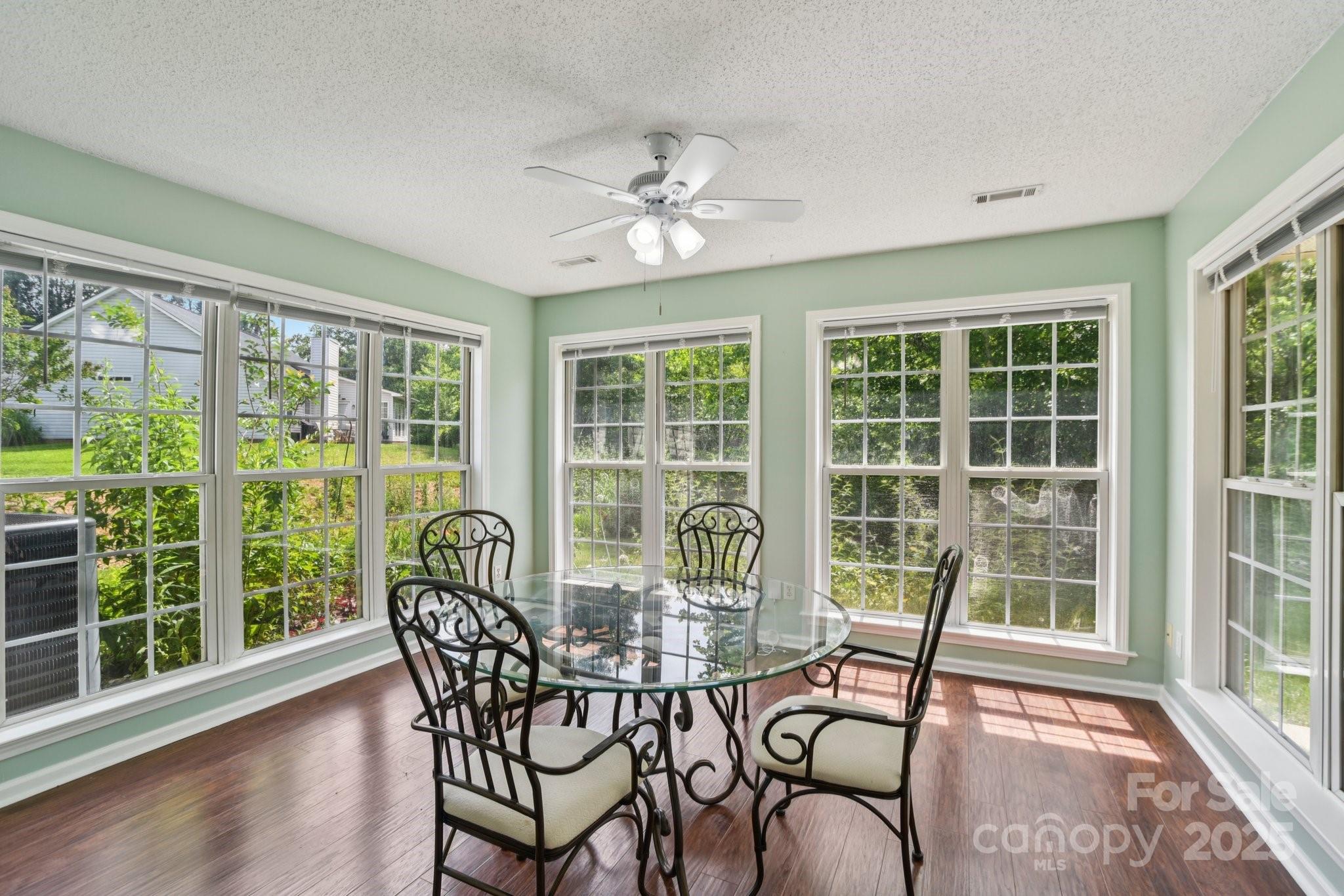 343 Stonehollow Road Fletcher, NC 28732 - Photo 5 of 36 a view of a dining room with furniture window and wooden floor