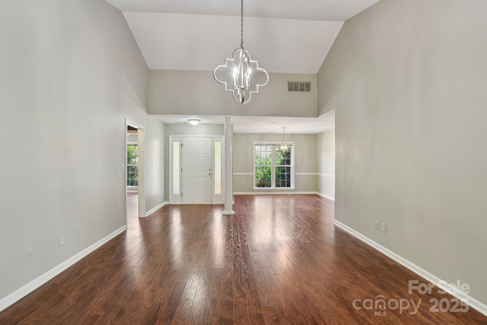 343 Stonehollow Road Fletcher, NC 28732 - Photo 8 of 36 a view of an empty room with wooden floor and a window
