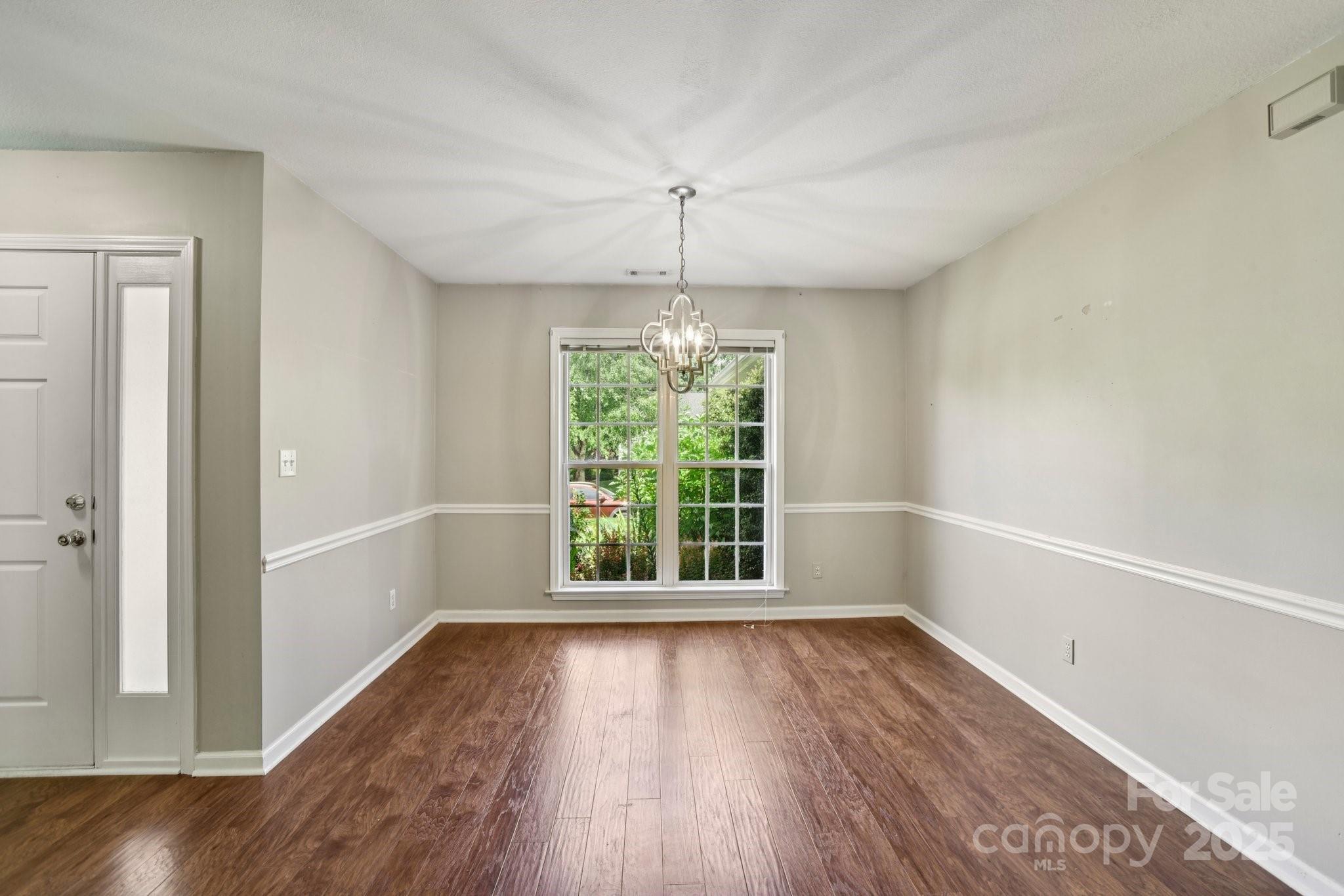 343 Stonehollow Road Fletcher, NC 28732 - Photo 10 of 36 wooden floor in an empty room with a window