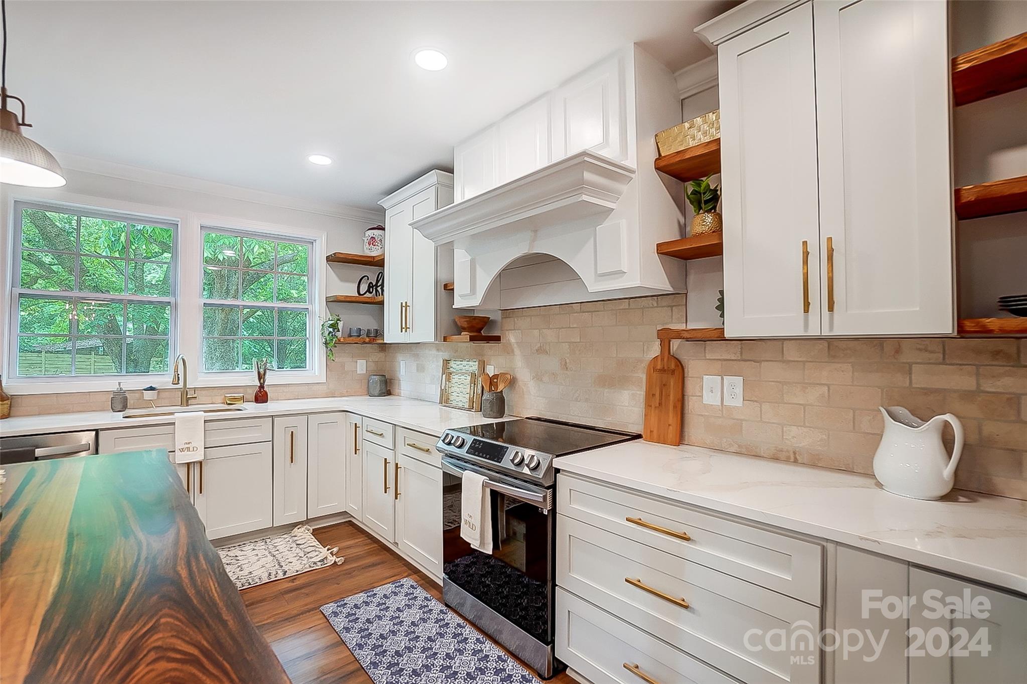 1129 Duckwood Road Lancaster, SC 29720 - Photo 20 of 48 a kitchen with a stove a sink and a microwave