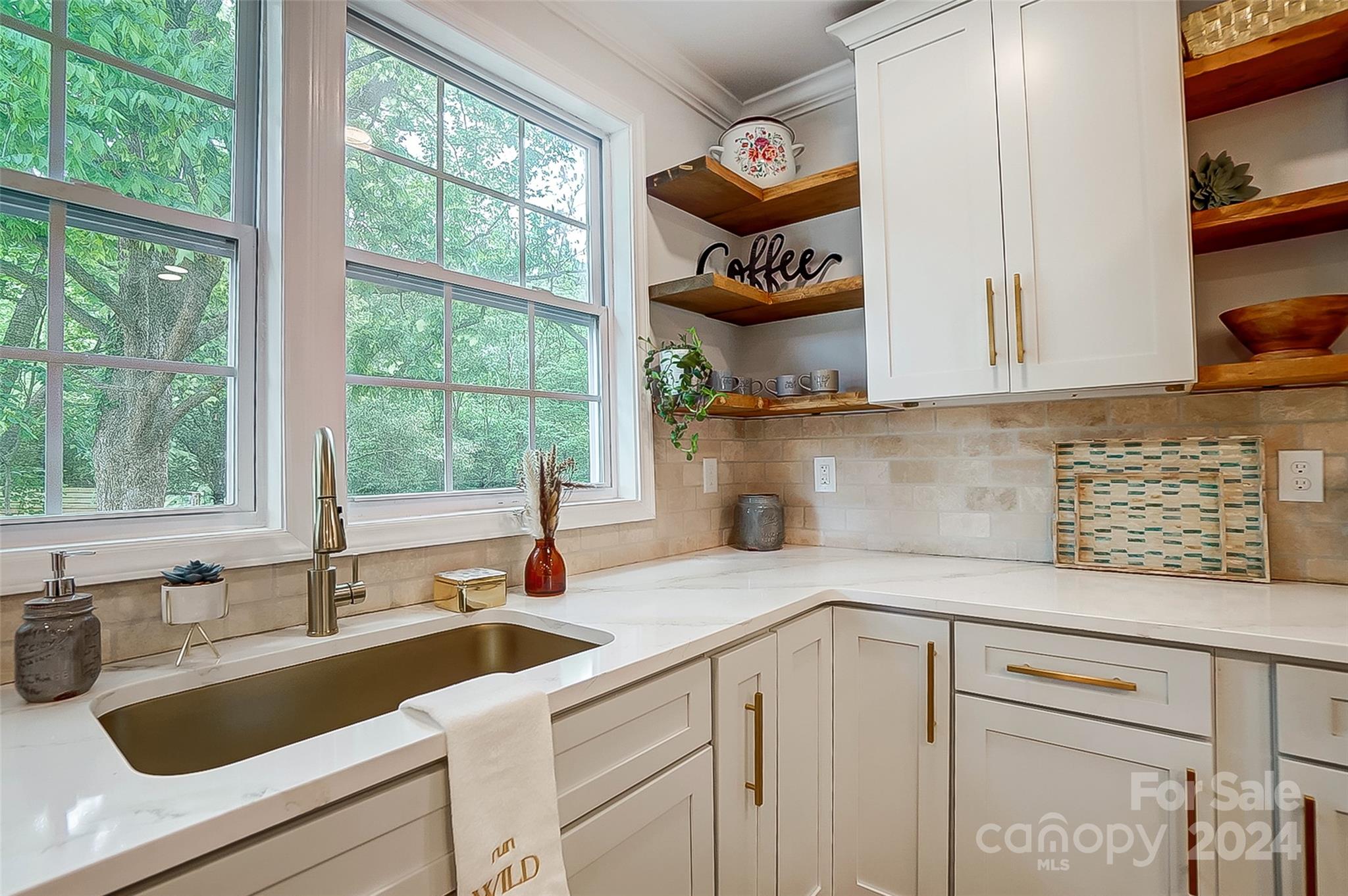 1129 Duckwood Road Lancaster, SC 29720 - Photo 21 of 48 a kitchen with a sink and a stove next to a window