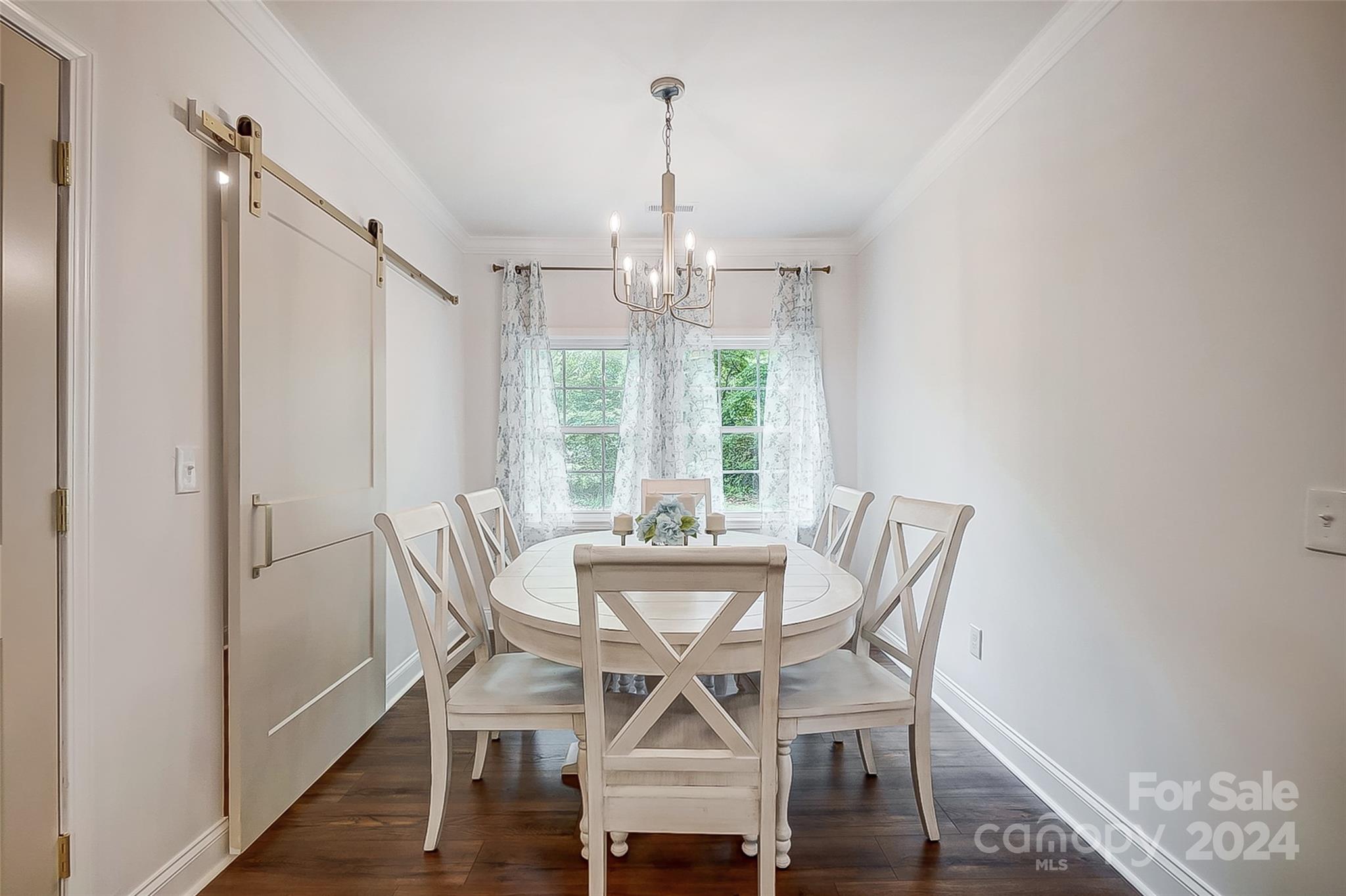 1129 Duckwood Road Lancaster, SC 29720 - Photo 24 of 48 a view of a dining room with furniture window and wooden floor