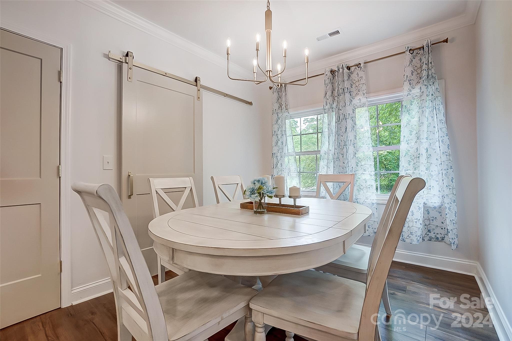 1129 Duckwood Road Lancaster, SC 29720 - Photo 25 of 48 a view of a dining room with furniture window and wooden floor