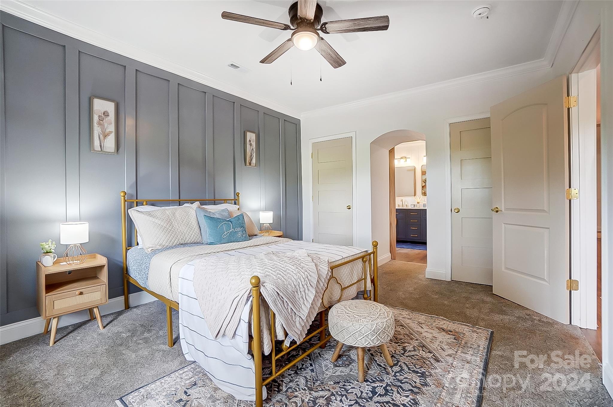 1129 Duckwood Road Lancaster, SC 29720 - Photo 29 of 48 a spacious bedroom with a bed and a chandelier