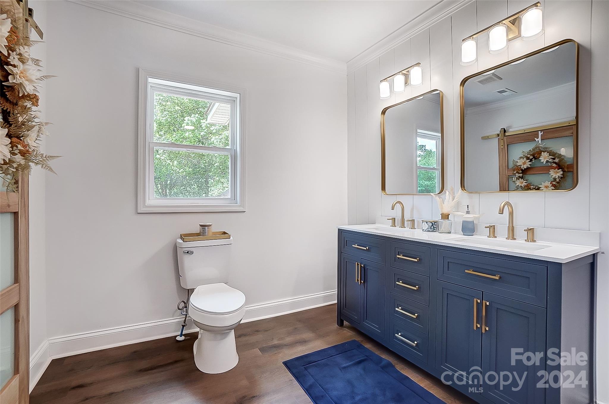 1129 Duckwood Road Lancaster, SC 29720 - Photo 33 of 48 a bathroom with a toilet a sink and mirror