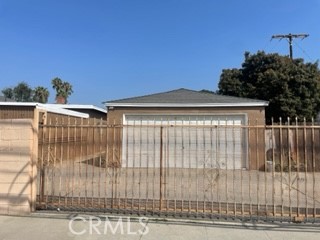 1540 South Pearl Avenue Compton, CA 90221 - Photo 2 of 6 a front view of a building with a garden