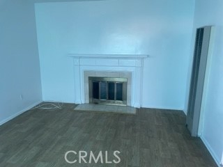 1540 South Pearl Avenue Compton, CA 90221 - Photo 3 of 6 a view of an empty room with a fireplace
