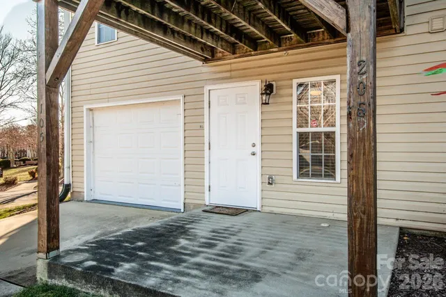 a view of house with garage