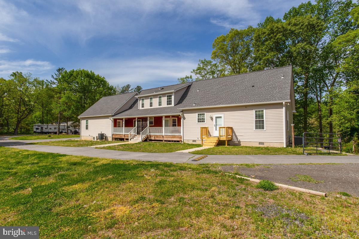 400 Adelina Road Prince Frederick, MD 20678 - Photo 7 of 57 Spacious home nestled in nature's embrace.