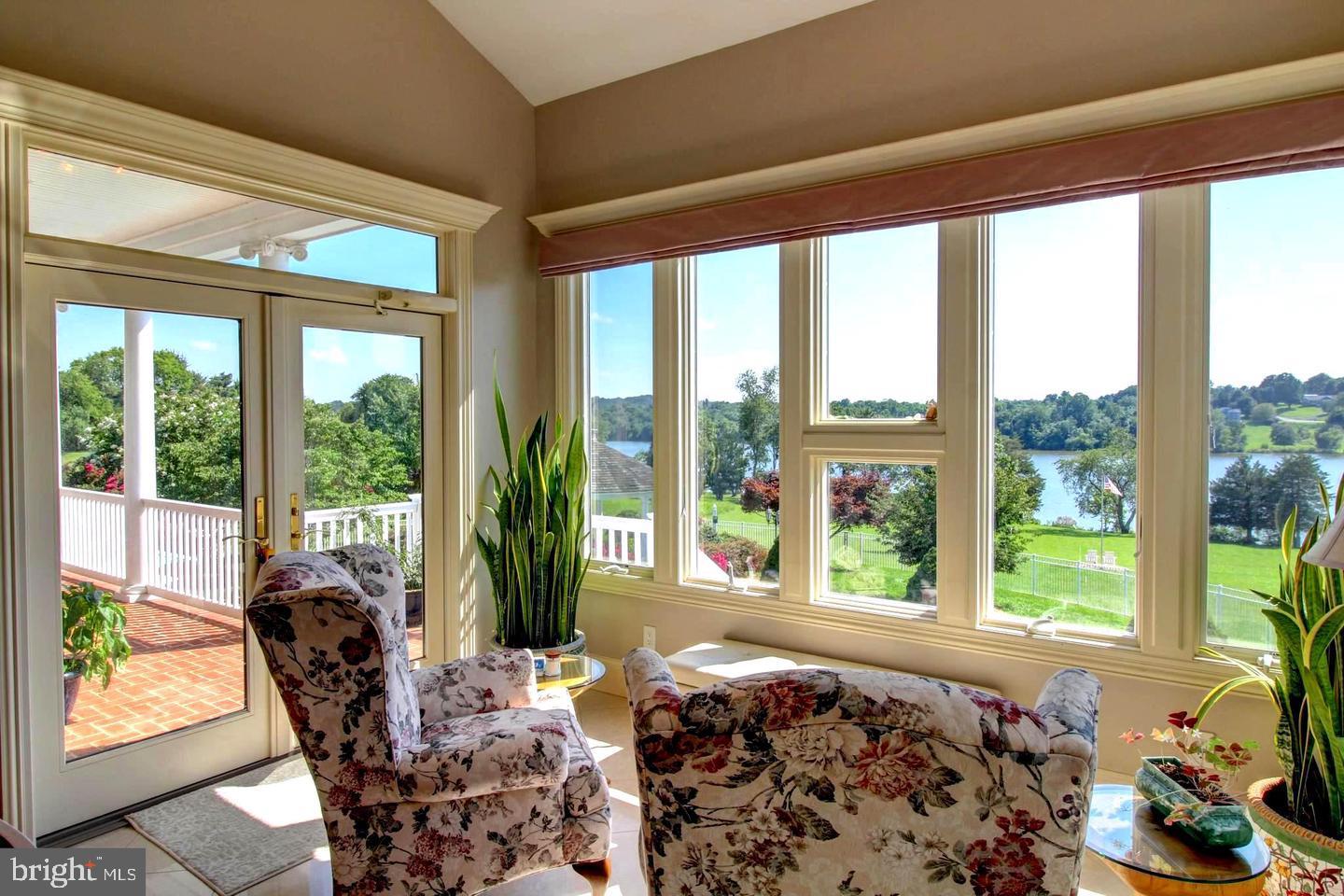 17235 Whisper Hill Road Culpeper, VA 22701 - Photo 16 of 24 a living room filled with furniture and a large window