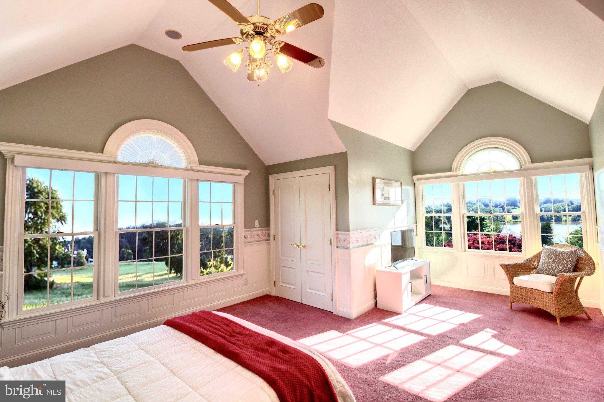 17235 Whisper Hill Road Culpeper, VA 22701 - Photo 9 of 24 a bedroom with a bed and a large window with outer view