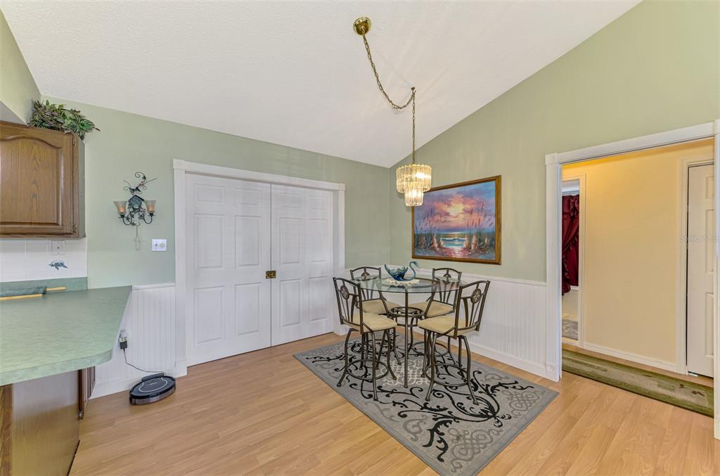 1137 Ponderosa Road Venice, FL 34293 - Photo 11 of 48 a view of a dining room with furniture window and wooden floor