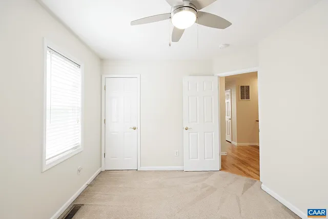a view of an empty room with a window