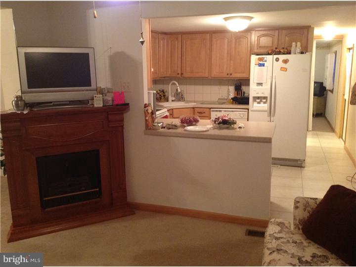 1762 Crown Point Road, Unit E9 Thorofare, NJ 08086 - Photo 11 of 23 a kitchen with refrigerator and stove