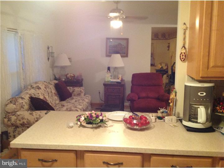1762 Crown Point Road, Unit E9 Thorofare, NJ 08086 - Photo 16 of 23 a kitchen with a refrigerator and stove