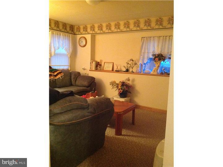 1762 Crown Point Road, Unit E9 Thorofare, NJ 08086 - Photo 19 of 23 a living room with furniture and a window