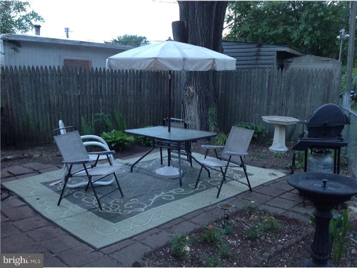 1762 Crown Point Road, Unit E9 Thorofare, NJ 08086 - Photo 4 of 23 a view of a chairs and table in patio