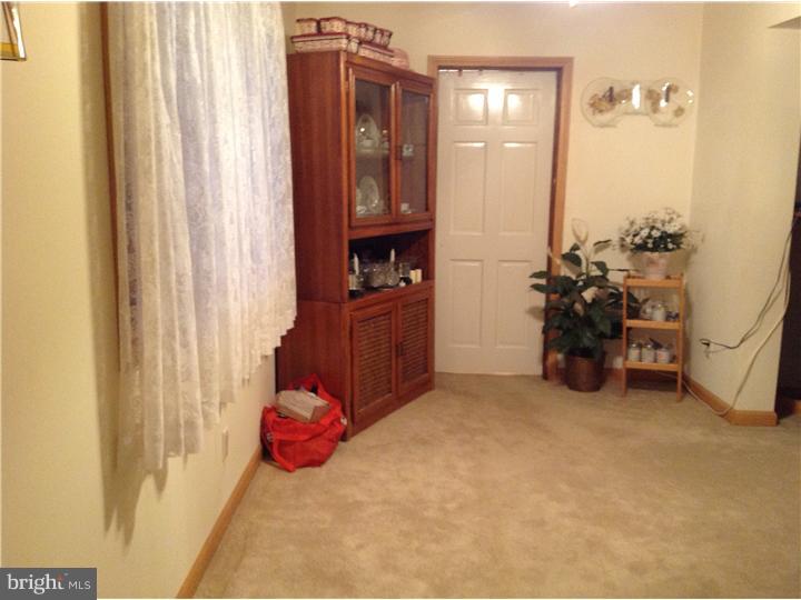 1762 Crown Point Road, Unit E9 Thorofare, NJ 08086 - Photo 10 of 23 a bedroom with a bed and a chandelier