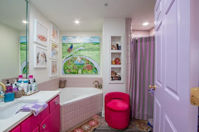 a bathroom with a bath tub sink and a toilet