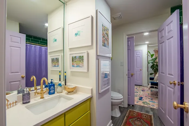 a view of a house with a wooden deck