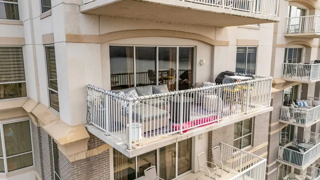 a roof deck view with a table and chairs