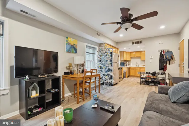a view of a livingroom with furniture and a flat screen tv