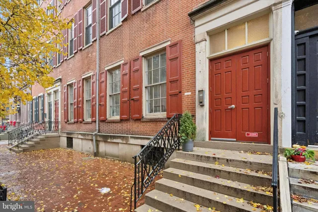 a view of a building with a door and a window