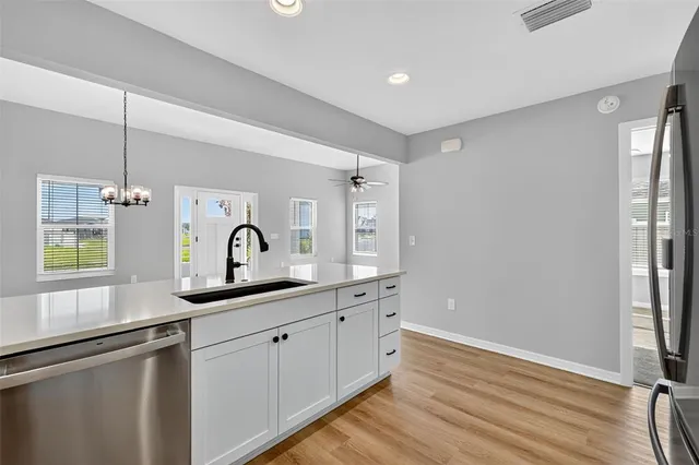 a spacious bathroom with a double vanity sink and a mirror