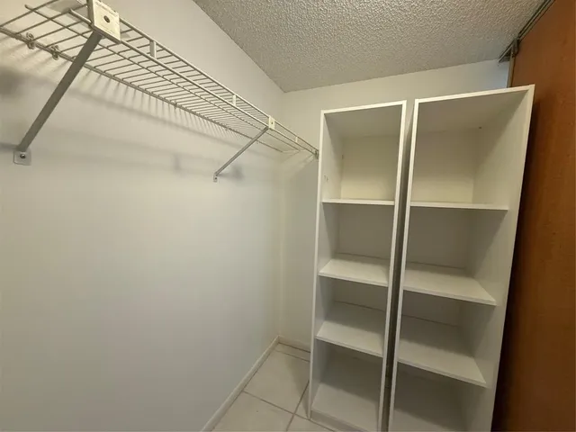 a view of swimming pool with outdoor seating and lake view