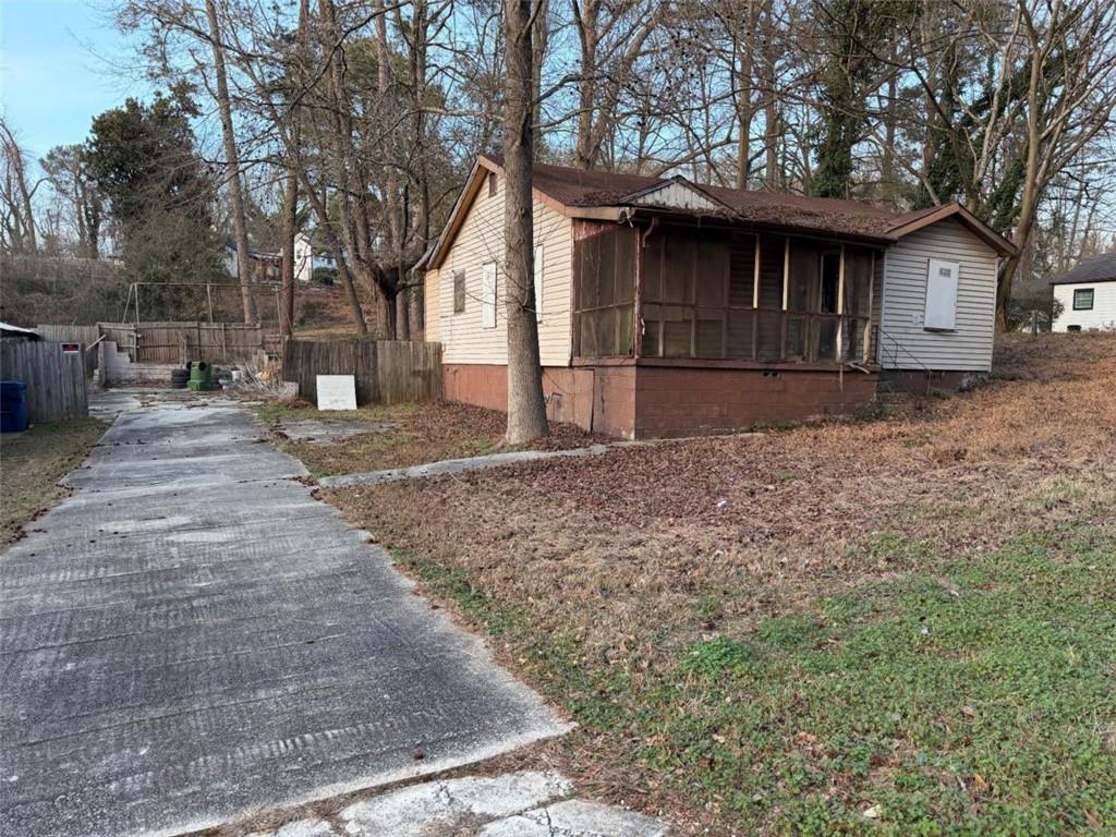 2105 Baker Road Northwest Atlanta, GA 30318 - Photo 2 of 4 a front view of a house with garden