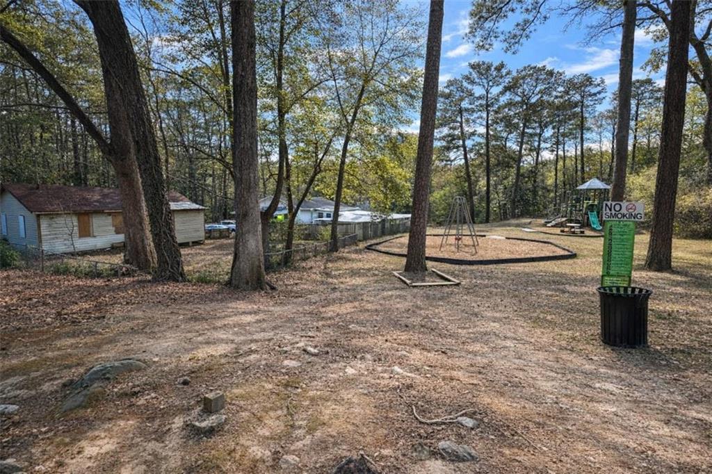 2105 Baker Road Northwest Atlanta, GA 30318 - Photo 4 of 4 a view of a street with a tree