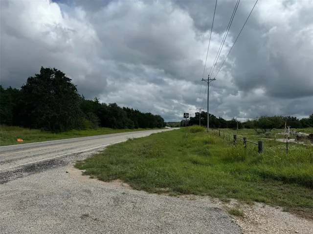 a view of a fountain in front of a house