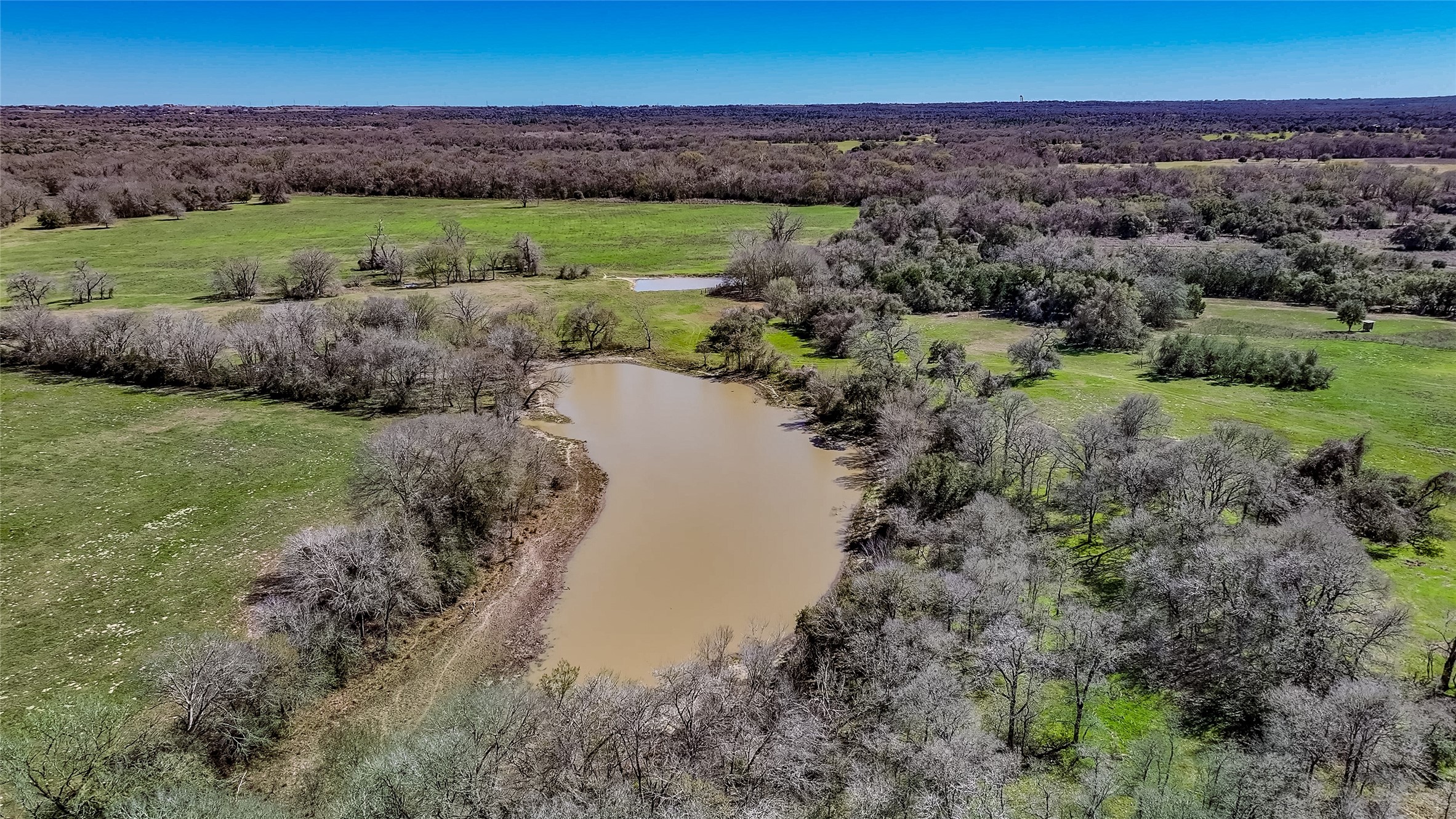 3817 Fm 154 Muldoon, TX 78949 - Photo 26 of 38 a view of a lake with green field