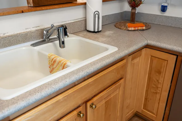 a kitchen with a stove and cabinets
