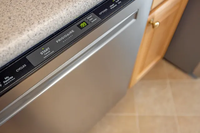 a kitchen with a sink cabinets and window