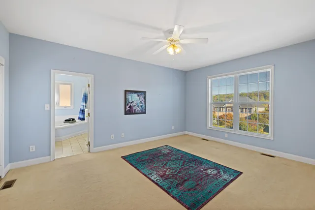 a bathroom with a sink double vanity granite tub and a mirror