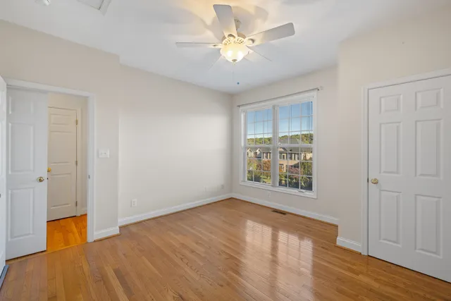 a view of an empty room with stairs