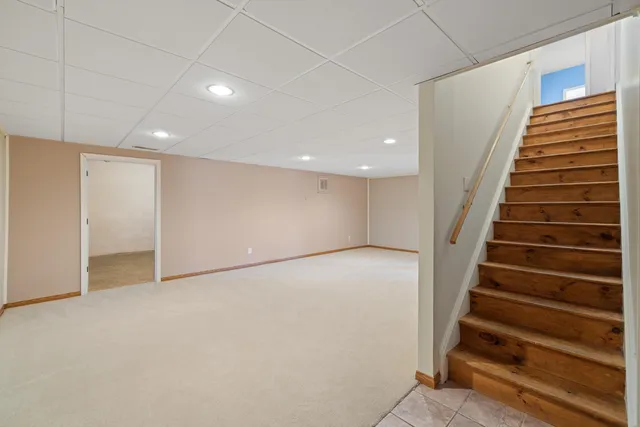 a view of an empty room with glass door