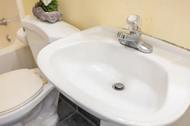 a view of a room with wooden walls